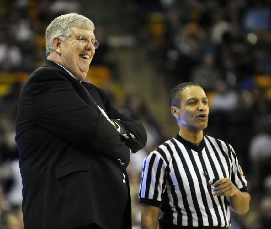 Utah State head coach Stew Morrill has a laugh with an official during a game between the Aggies and Colorado State at the Dee Glen Smith Spectrum in Logan on Wednesday, January 15, 2014. After 17 years at Utah State, Morrill is expected to retire at the end of this season. (Matt Gade/Deseret News)