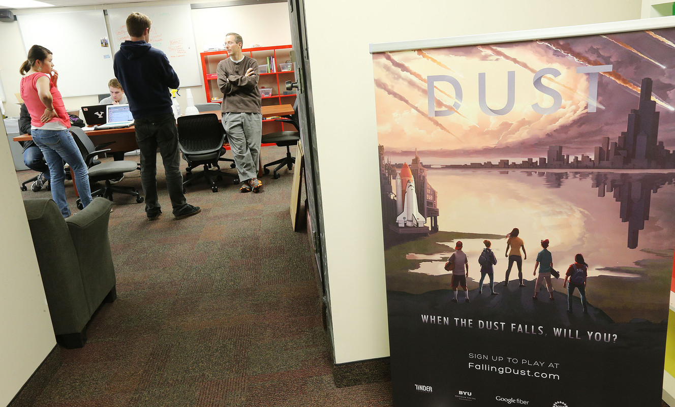 BYU student Scott James talks with producer Derek Hansen as students work on a new game to support STEM learning Friday, Jan. 9, 2015, in the Harris Fine Arts Center in Provo. (Photo: Scott G Winterton, Deseret News)