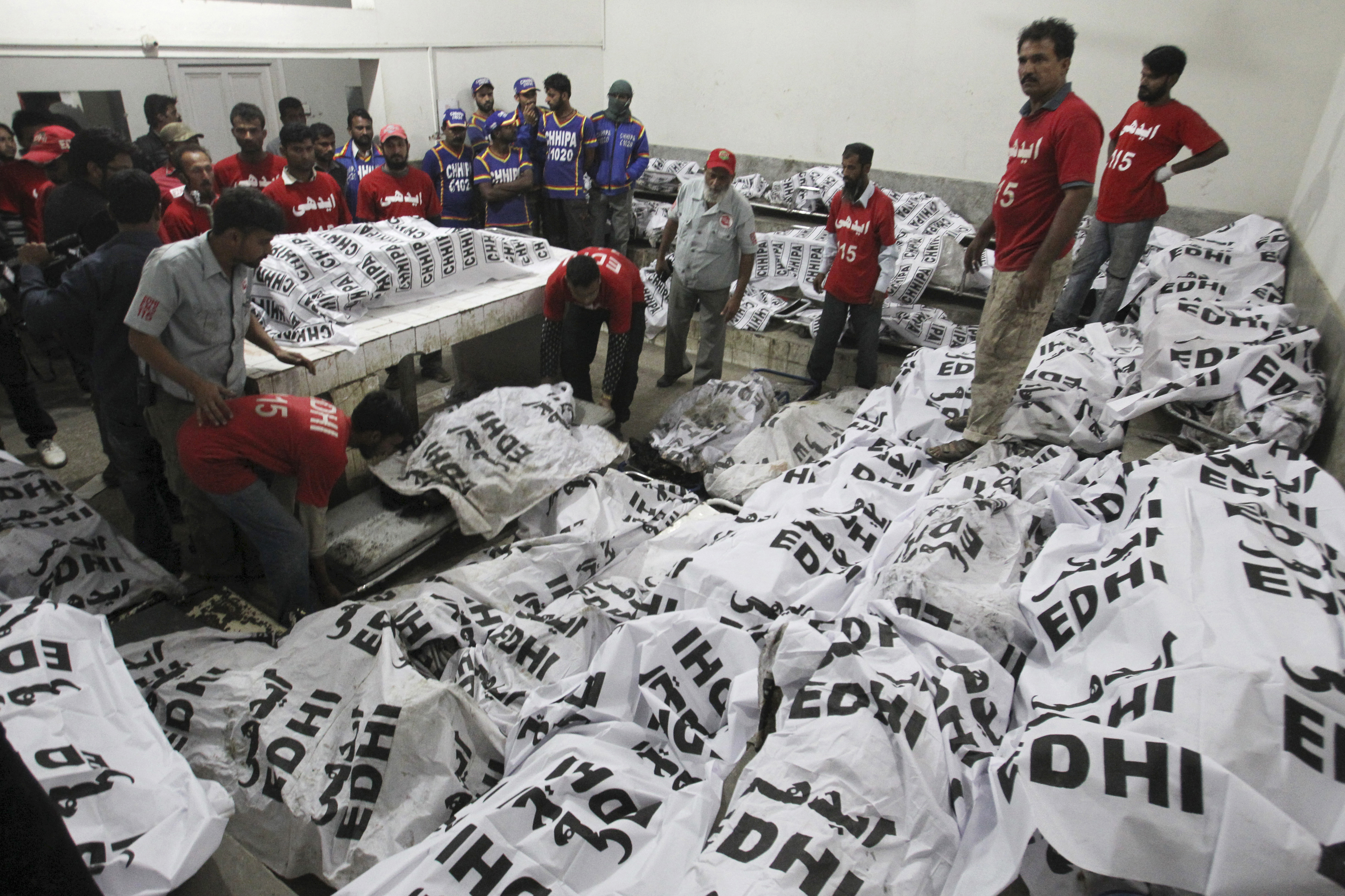 Bus crashes into oil tanker in southern Pakistan, killing 57