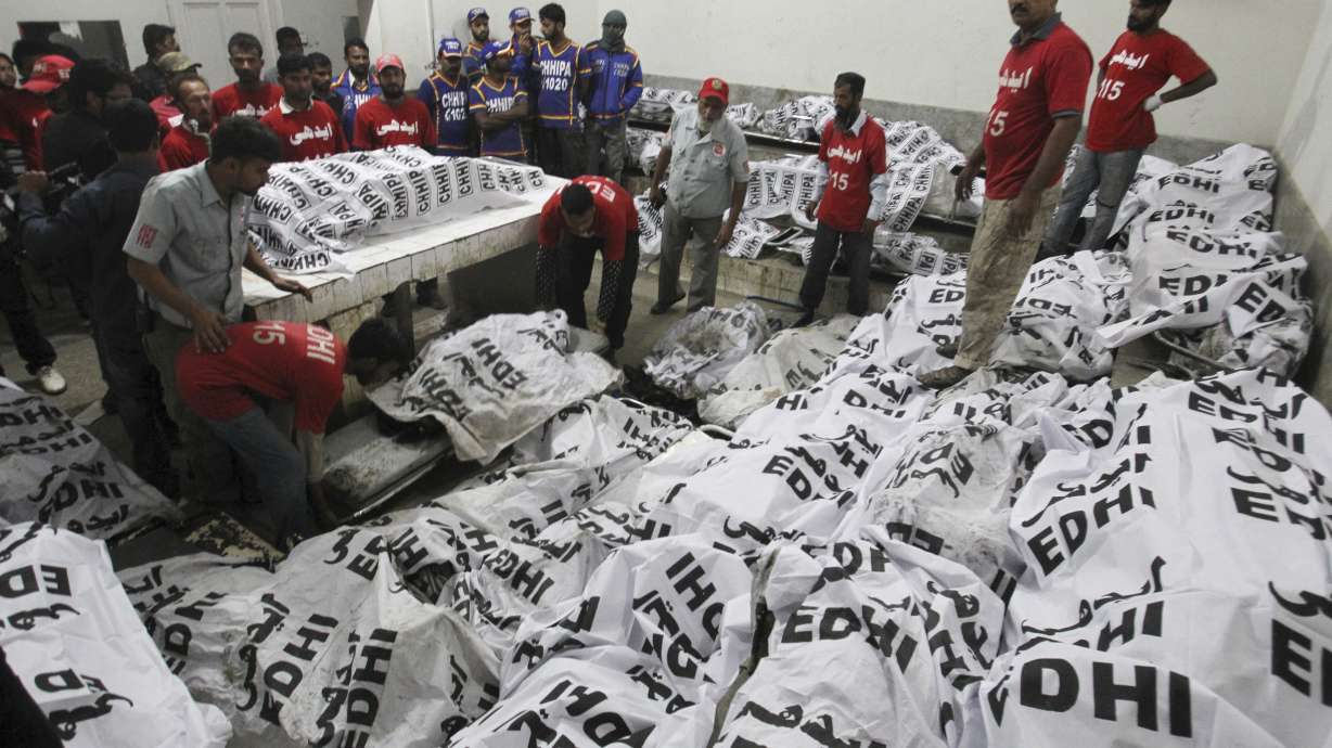 Bus crashes into oil tanker in southern Pakistan, killing 57