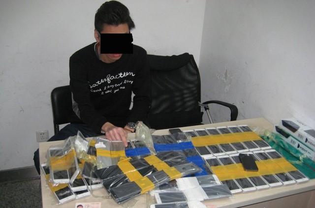 Customs officers in Shenzhen, China detained a Hong Kong man trying to smuggle 94 iPhones into Mainland China from Hong Kong Monday, Jan. 12, 2015. The unidentified man had the phones worth $49,000 taped to his body, police said.
Credit:	Shenzhen Huanggang Customs