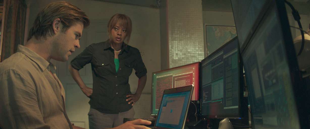 This photo provided by Universal Pictures shows, Chris Hemsworth, left, as Nicholas Hathaway, and Viola Davis, as FBI Special Agent Carol Barrett, in Legendary's film, "Blackhat."