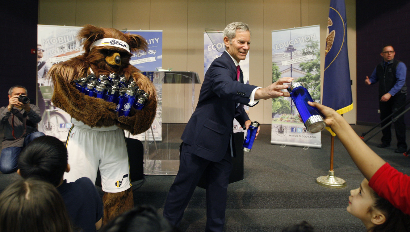 Salt Lake City Mayor Ralph Becker passes out water bottles with the Utah Jazz Bear after he presented the State of the City Address at Whittier Elementary School in Salt Lake City Wednesday, Jan. 14, 2015. (Photo: Chelsey Allder/Deseret News)