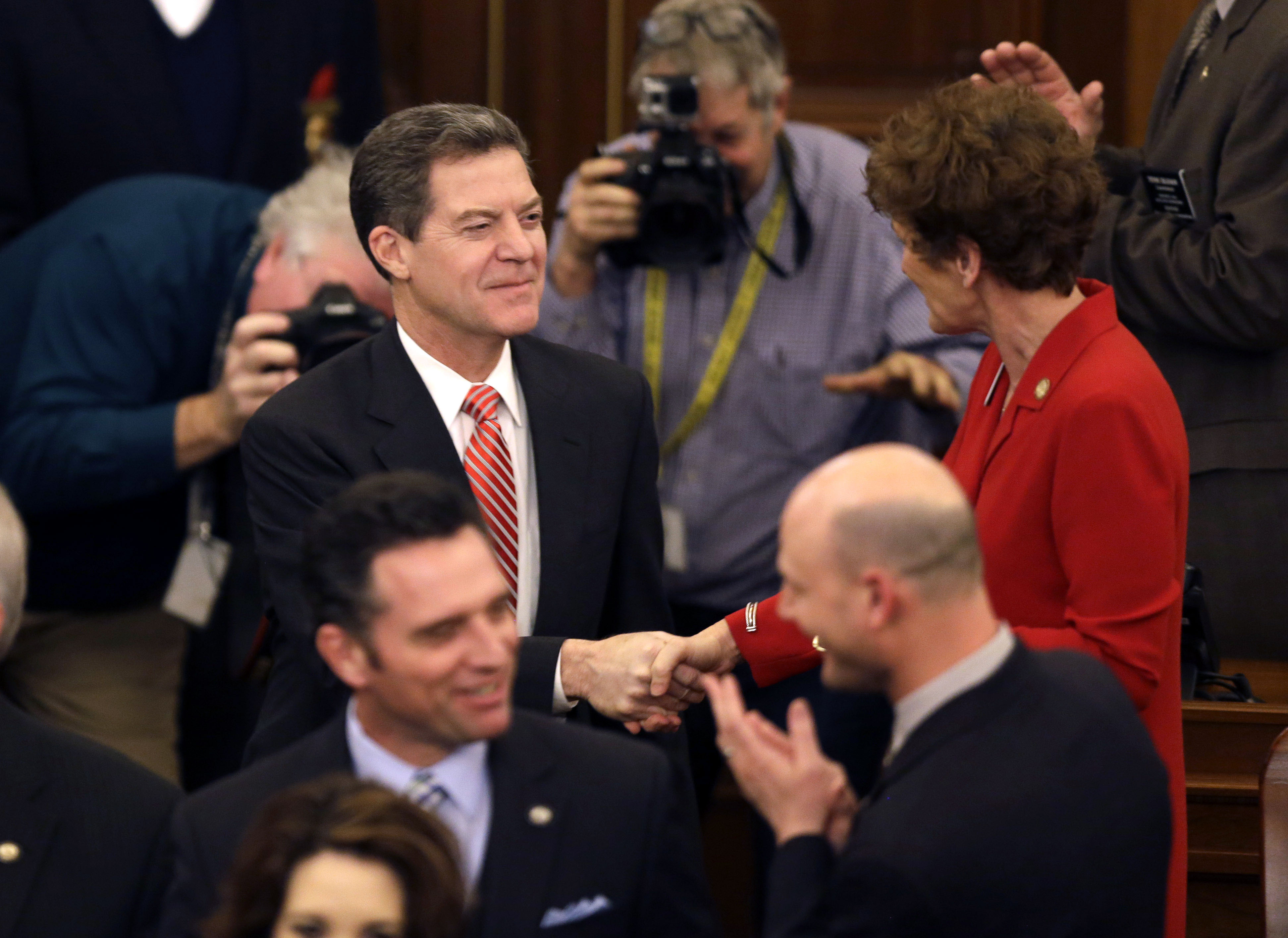 Governor says Kansas will continue moving to no income tax