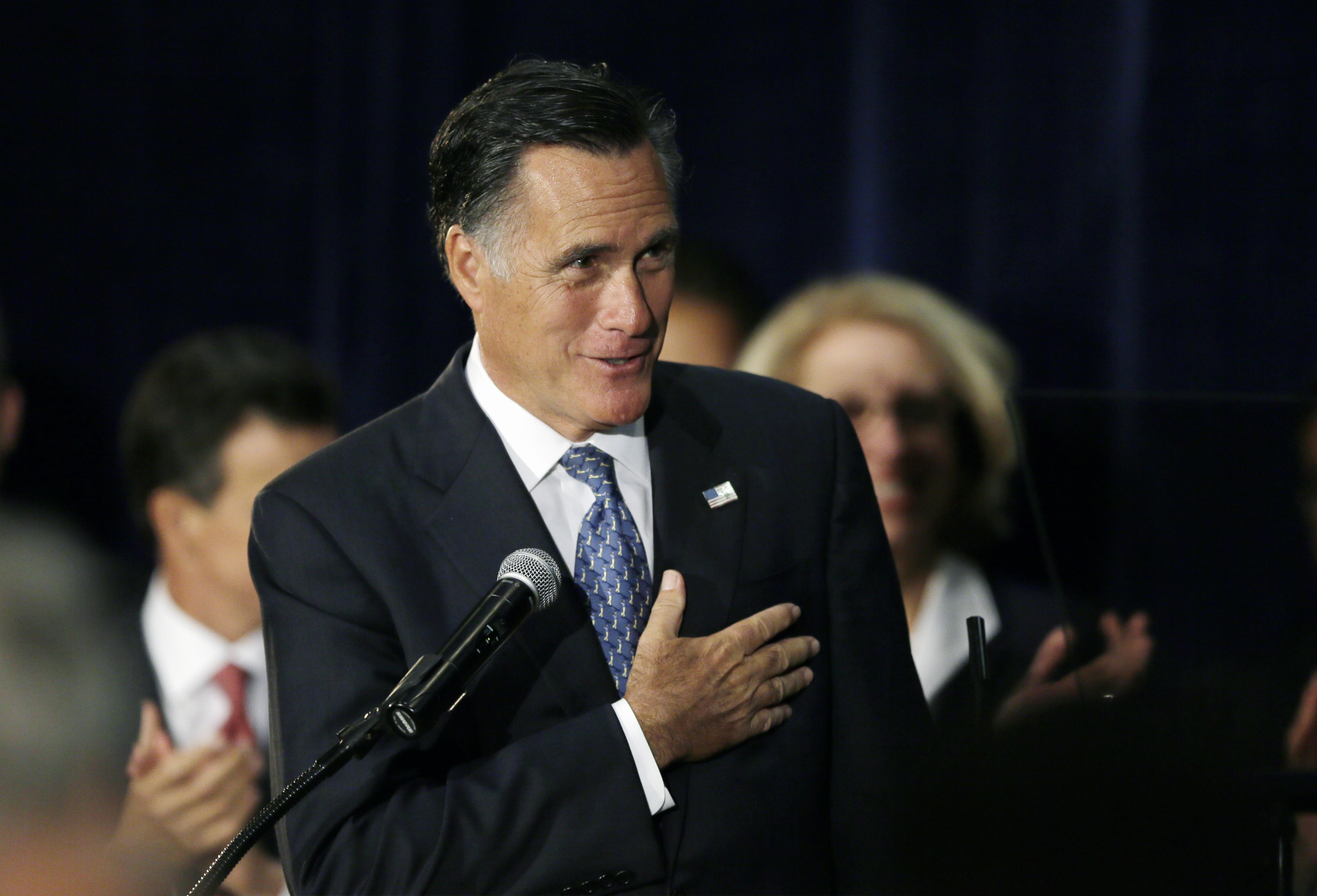 Former Massachusetts Gov. and 2012 Republican presidential candidate Mitt Romney campaigns for Michigan Senate candidate Terri Lynn Land during a rally in Livonia, Mich., Thursday, Oct. 2, 2014. Romney said during Thursday's rally that a Land win is crucial to returning control of the Senate to their party. Romney told the hundreds of cheering supporters at a Livonia banquet hall that "help is on the way" in the form of Land, who is pitted in a tight race with Democratic Rep. Gary Peters. (AP Photo/Carlos Osorio)