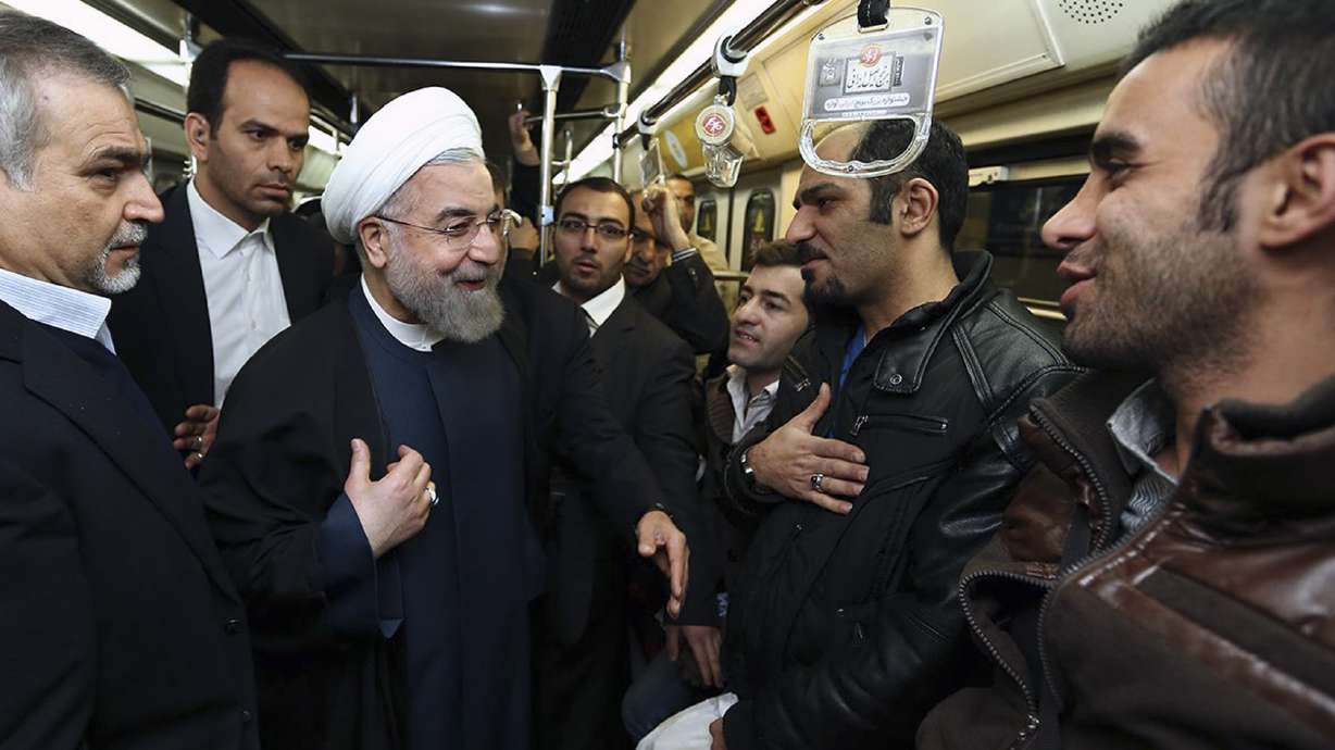 Surprised Iran subway riders brush shoulders with president