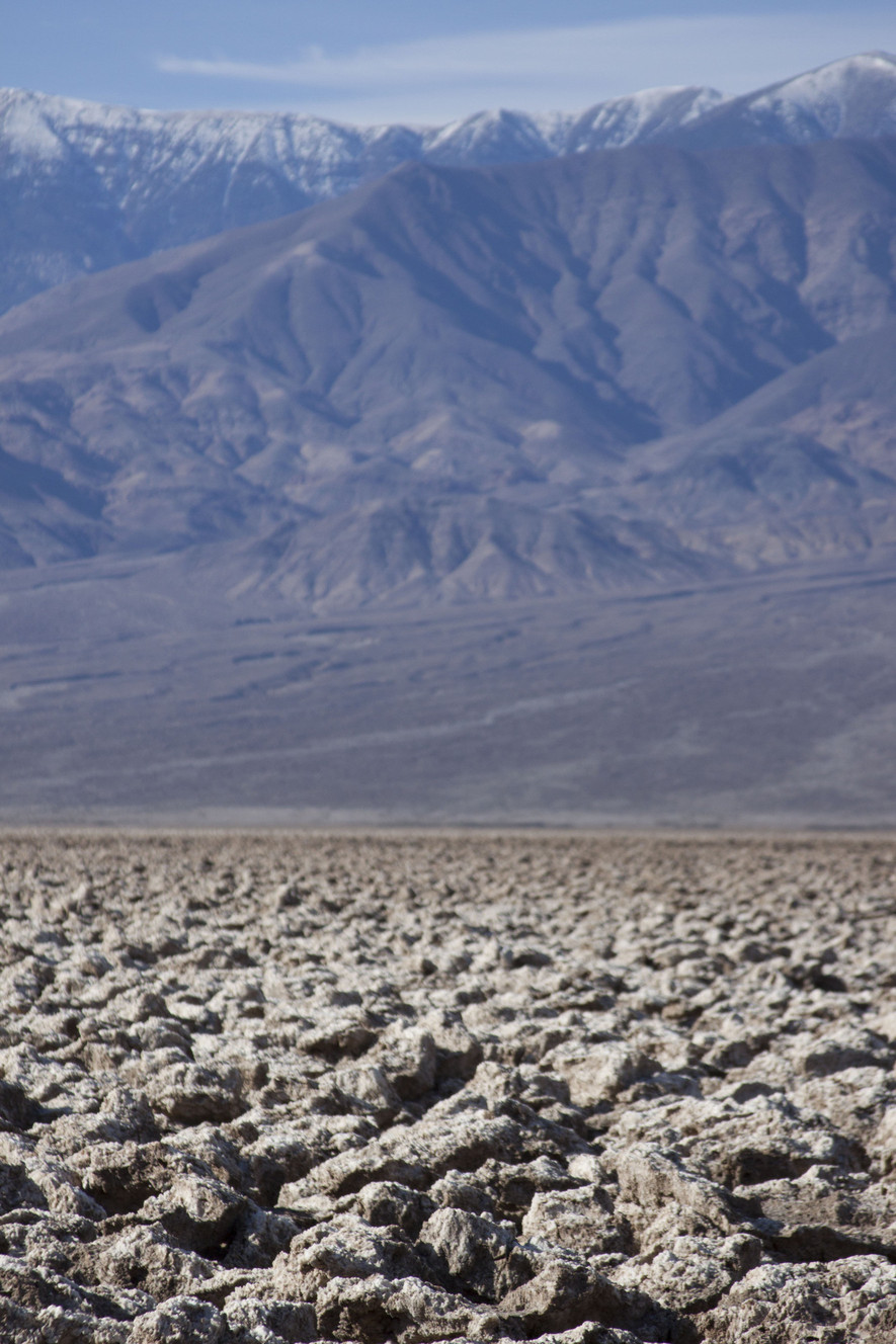 The Devil's Golf Course is a surprising geological feature that seems to rise out of the dust. In the winter, the mountains that surround the valley are snowcapped. (Photo: Celeste Tholen Rosenlof)