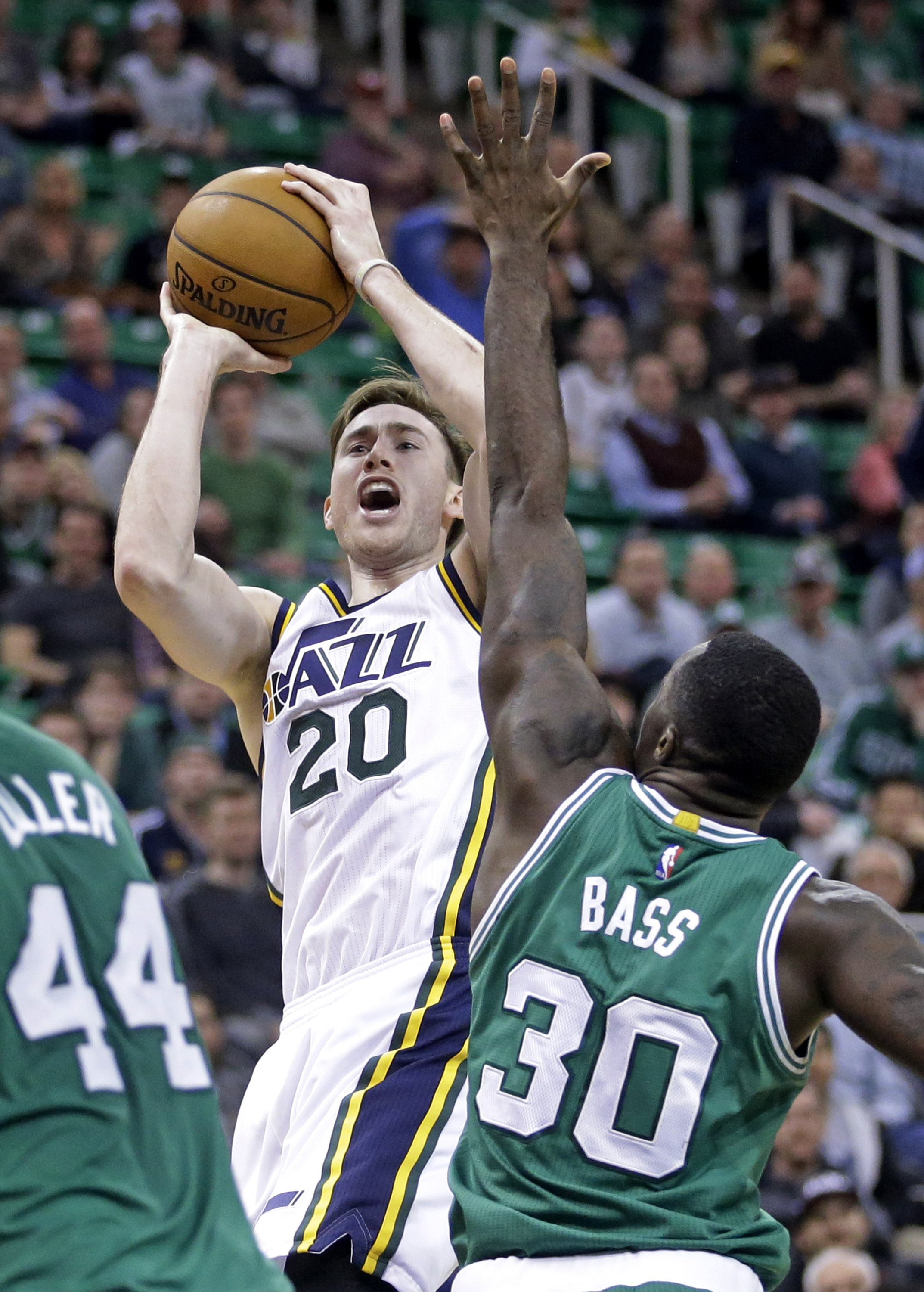 Utah Jazz forward Gordon Hayward (20) shoots as Boston Celtics forward Brandon Bass (30) defends in the fourth quarter during an NBA basketball game Monday, Jan. 26, 2015, in Salt Lake City. The Celtics won 99-90. (AP Photo/Rick Bowmer)
