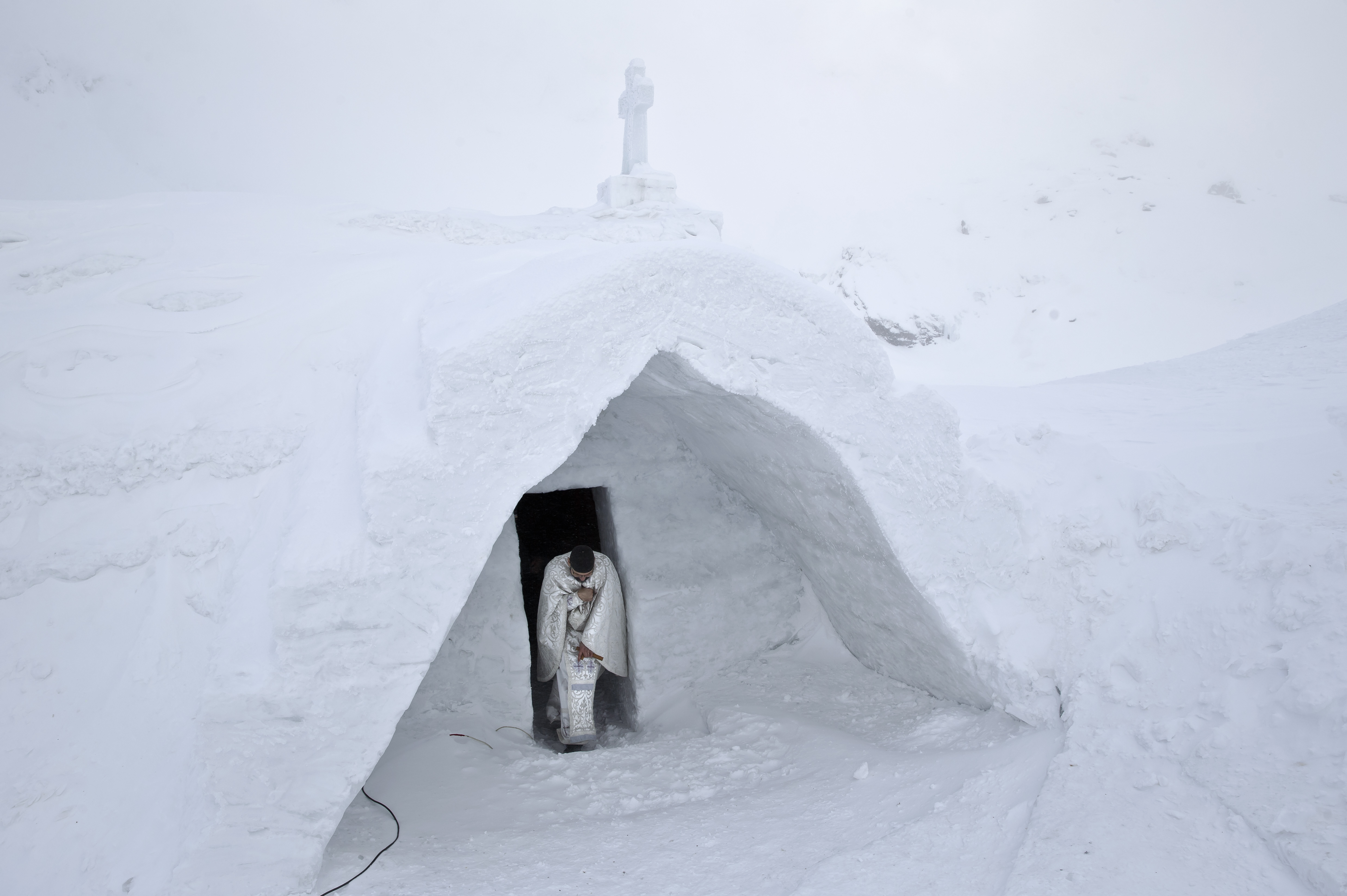 Romanian mountain Ice Church draws all types of Christians