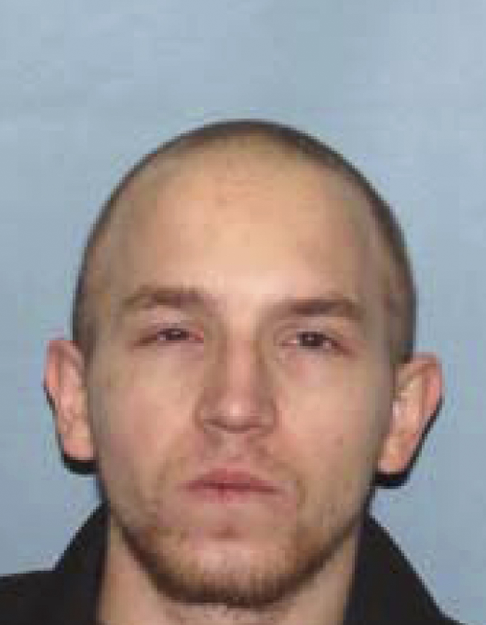 Federal warrant issued for suspect in elderly pair's slaying