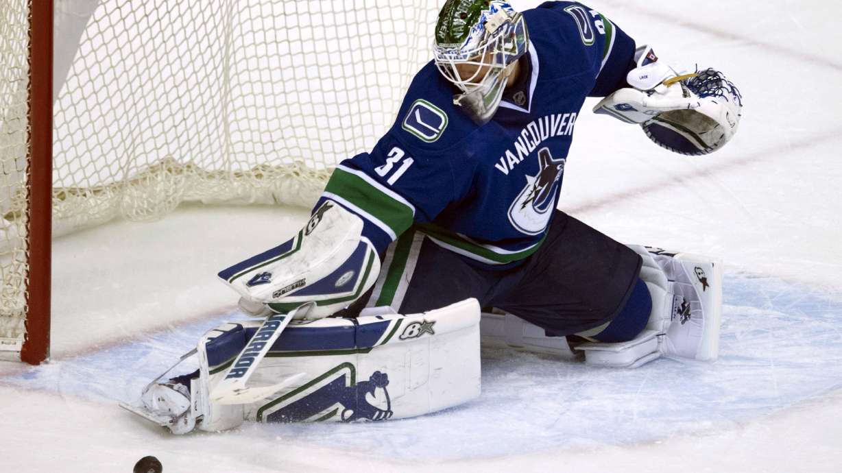 Sbisa scores in overtime, Canucks ground Jets 3-2