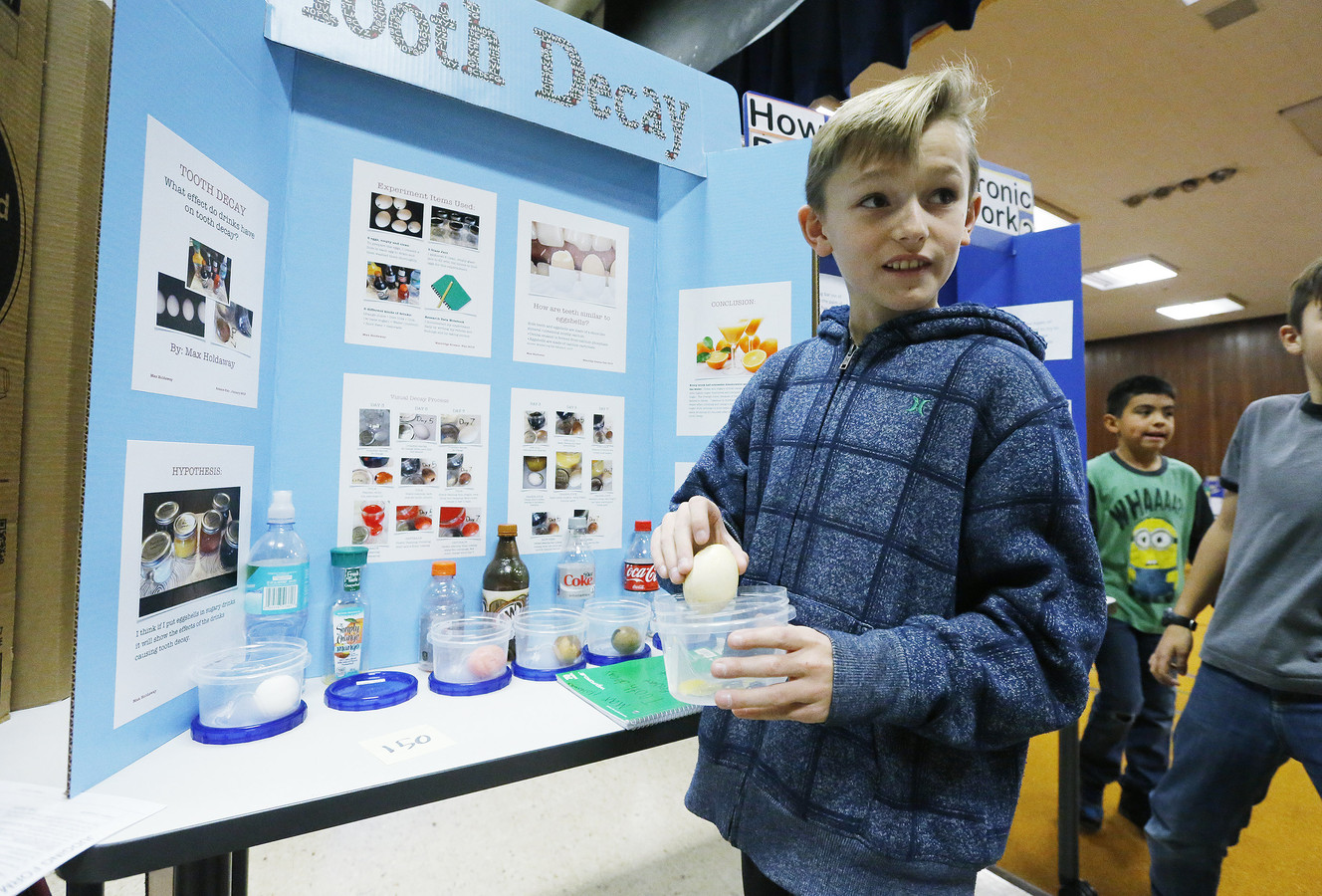 Westridge Elementary school fourth-grader Max Holdaway shows off his tooth decay project at the science fair in Provo Wednesday, Feb. 4, 2015. The Provo-Orem area is one of 15 large U.S. metro areas home to more STEM graduates as a share of the young adult population than Finland, the global leader. (Photo: Jeffrey D. Allred, Deseret News)