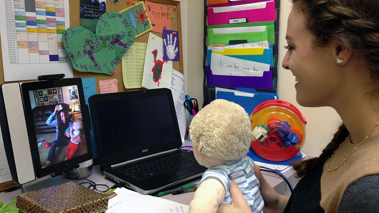 Reaching deaf babies with implants, iPads and therapy