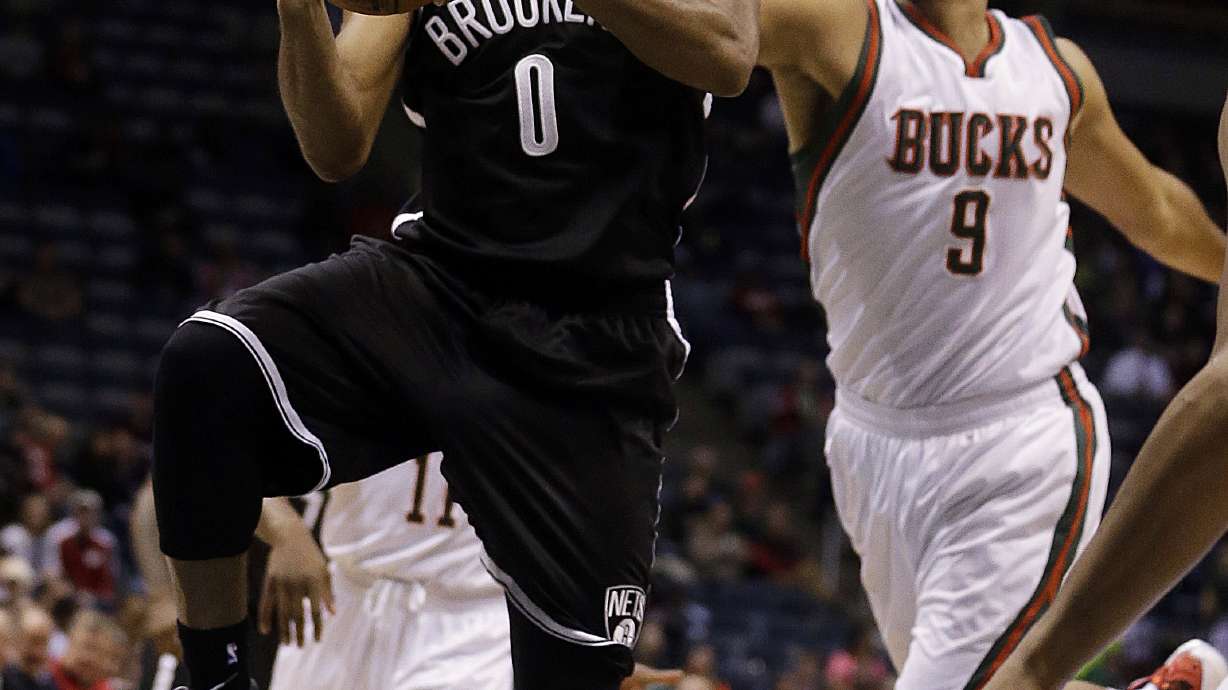 Bucks rally from 17 down, beat Nets 103-97