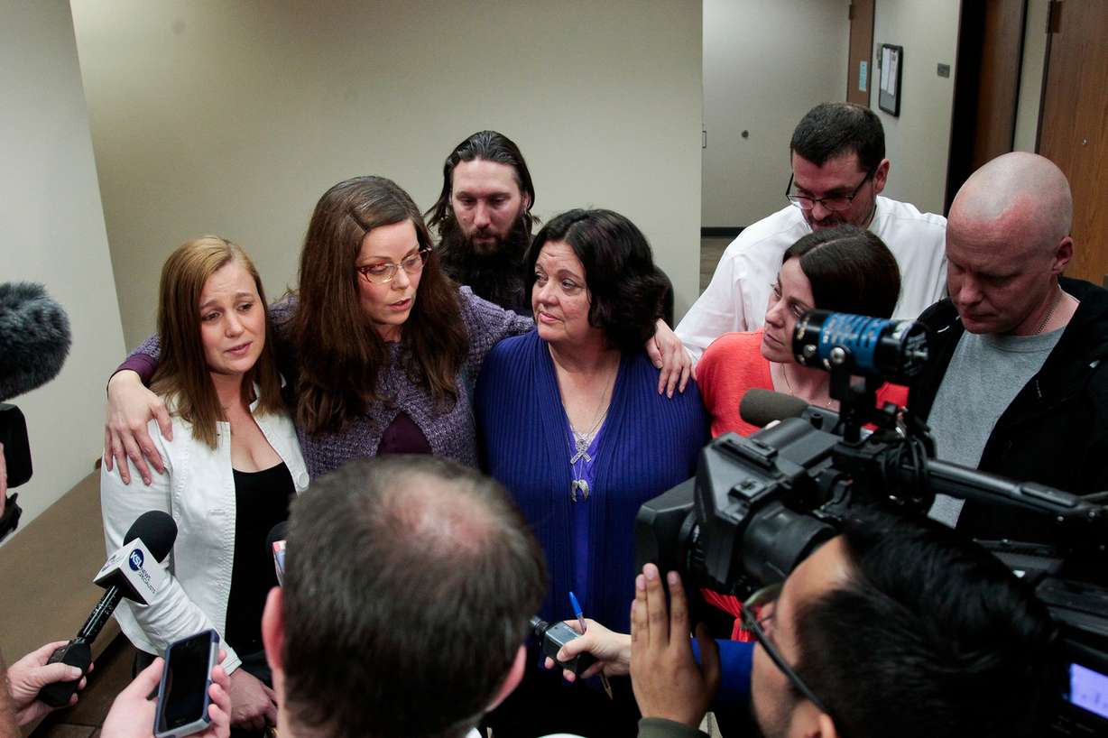 Family members of Heidy Truman, including her mother, Janet Wagner, center, and sisters Amanda Wagner, Autumn Wagner and Sommer Keller, speak to the media following the sentencing of Conrad Truman at 4th District Court in Provo on Monday, Feb. 9, 2015. Truman was sentenced to consecutive sentences of 15 years to life for murder and one to 15 years for obstruction of justice in the 2012 shooting death of his wife, Heidy Truman. (Photo: Spenser Heaps)