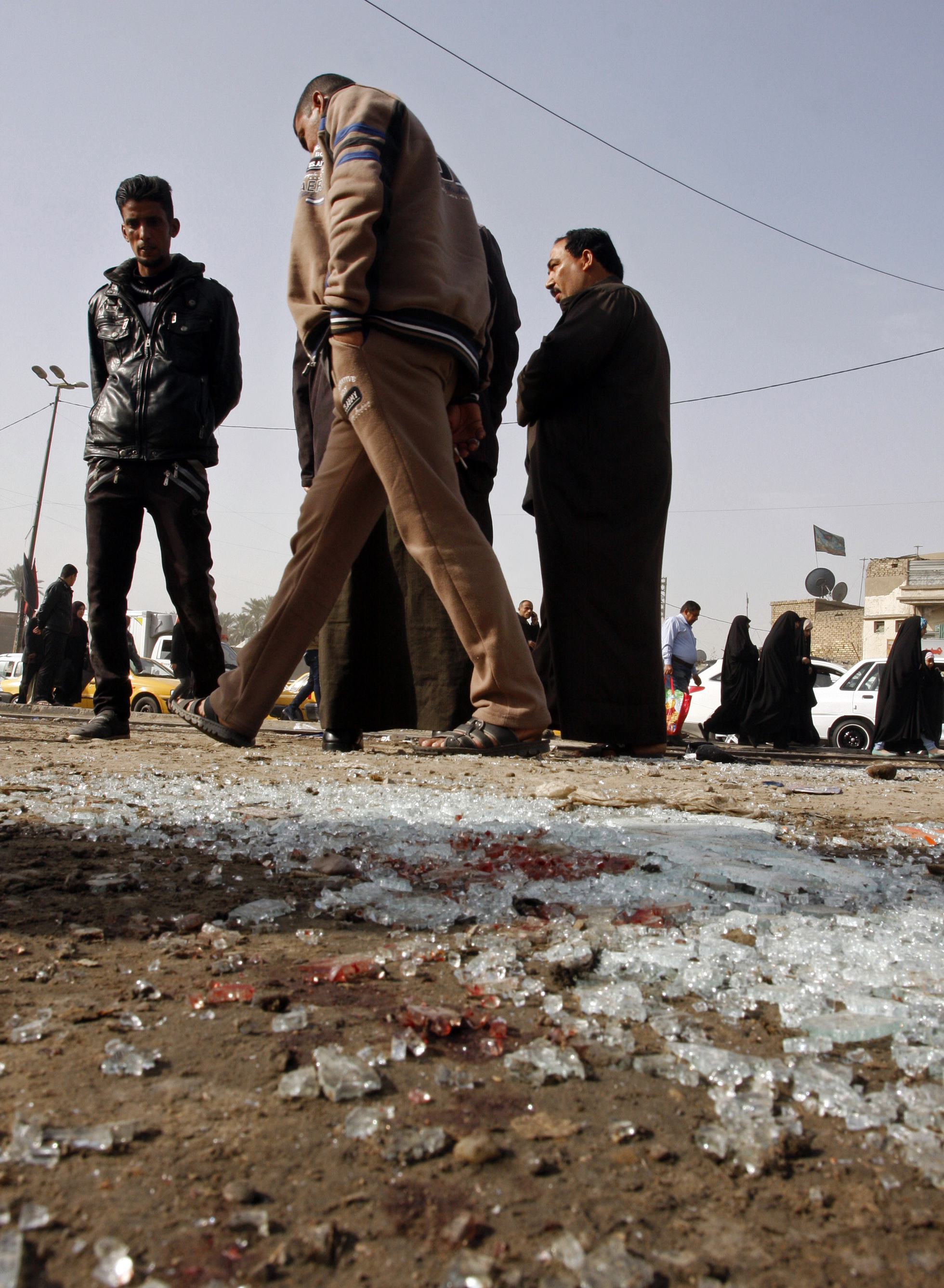 Officials say attacks outside Iraq's capital kill 8 people