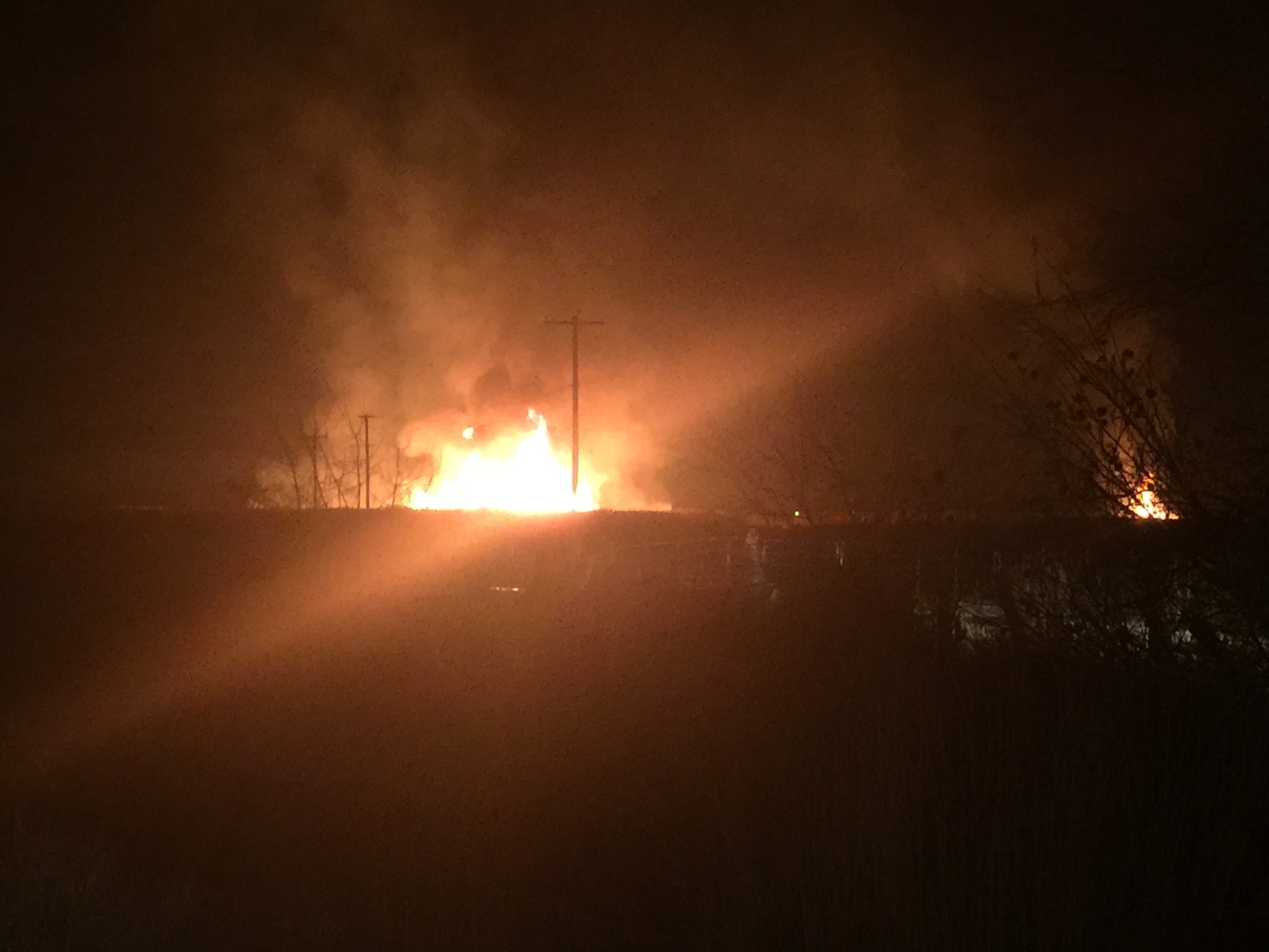 Small grass fire burns brightly in Weber County