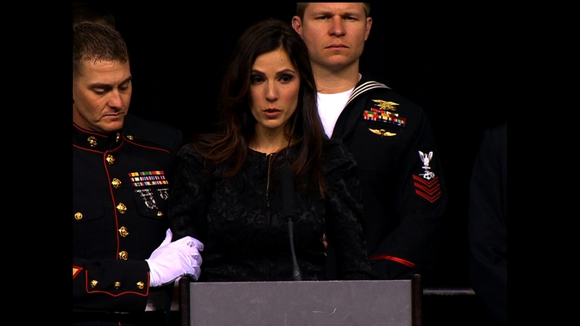 Friends and family of Chris Kyle, a slain ex-Navy SEAL sniper, gathered Monday at a football stadium in north Texas to say their final goodbyes. "I stand before you a broken woman," Taya Kyle, Chris Kyle's widow, told the crowd at Cowboys Stadium in Arlington, Texas. "But I am now, and always will be, the wife of a man who was a warrior both on and off the battlefield." (Pool)