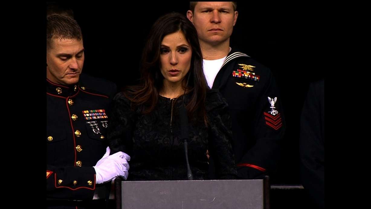 Friends and family of Chris Kyle, a slain ex-Navy SEAL sniper, gathered Monday at a football stadium in north Texas to say their final goodbyes. "I stand before you a broken woman," Taya Kyle, Chris Kyle's widow, told the crowd at Cowboys Stadium in Arlington, Texas. "But I am now, and always will be, the wife of a man who was a warrior both on and off the battlefield." (Pool)
