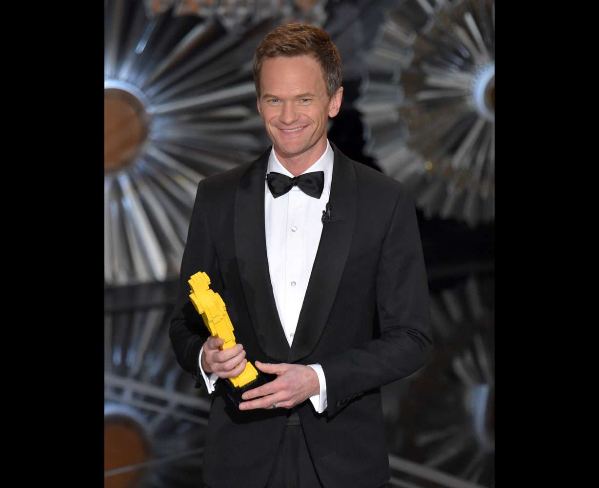 Host Neil Patrick Harris holds a Lego Oscar statuette at the Oscars on Sunday, Feb. 22, 2015, at the Dolby Theatre in Los Angeles. (Photo by John Shearer/Invision/AP)