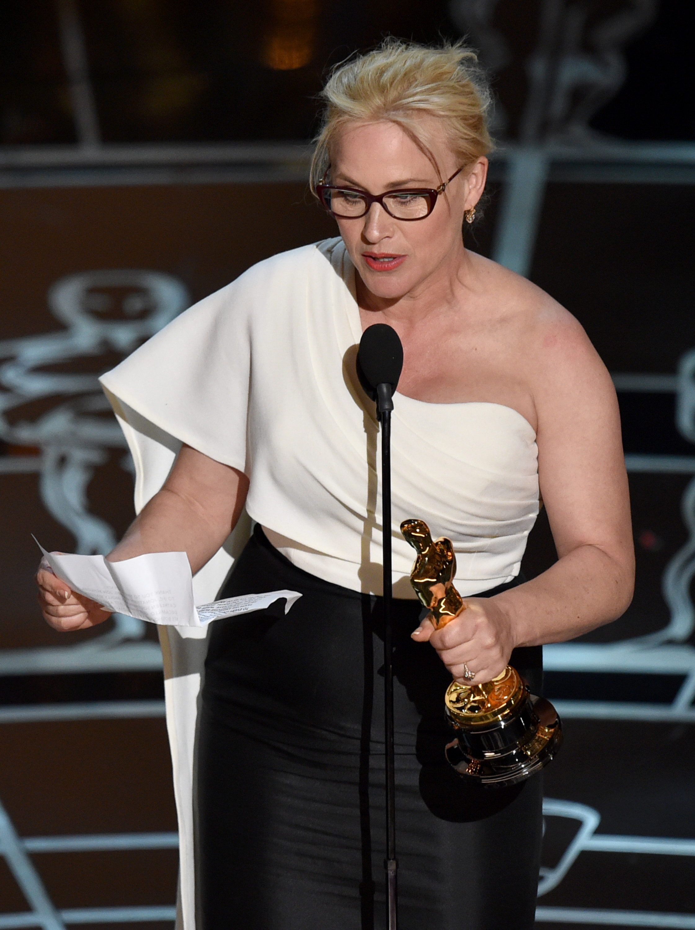 Patricia Arquette accepts the award for best actress in a supporting role for "Boyhood" at the Oscars on Sunday, Feb. 22, 2015, at the Dolby Theatre in Los Angeles. (Photo by John Shearer/Invision/AP)