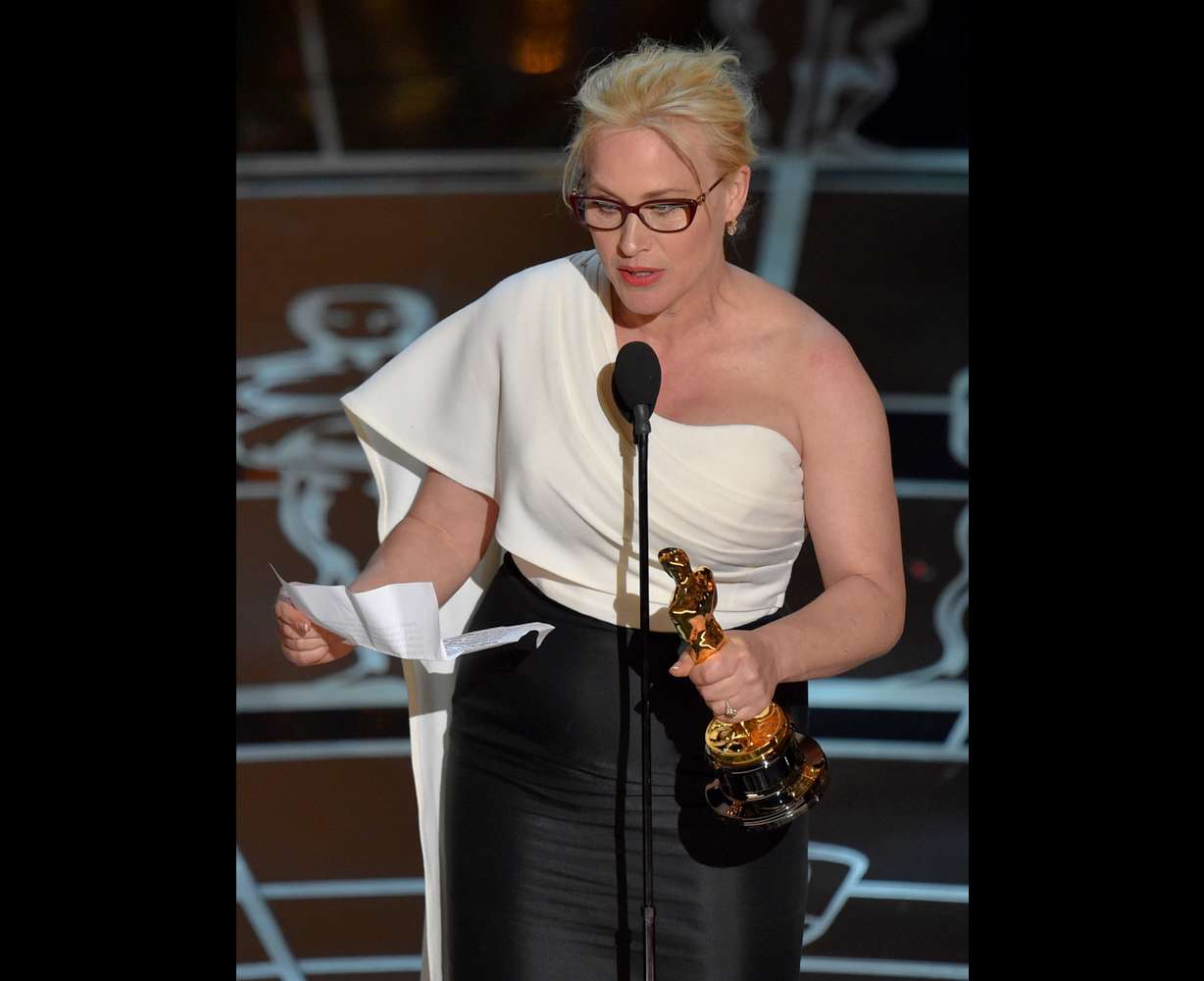 Patricia Arquette accepts the award for best actress in a supporting role for "Boyhood" at the Oscars on Sunday, Feb. 22, 2015, at the Dolby Theatre in Los Angeles. (Photo by John Shearer/Invision/AP)