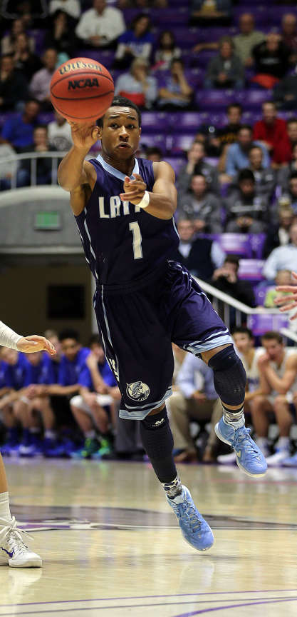 Julian Blackmon pushes the ball up the court during Layton's win over Bingham in the Class 5A boys basketball state tournament Wednesday in Ogden. (Ravell Call/Deseret News)