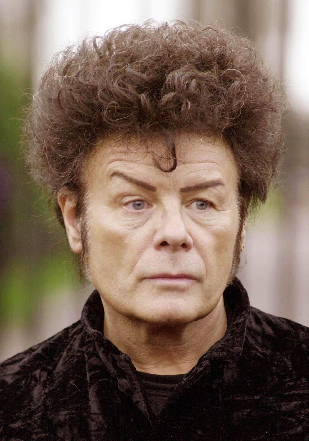 Former pop star Gary Glitter sentenced to 16 years in prison