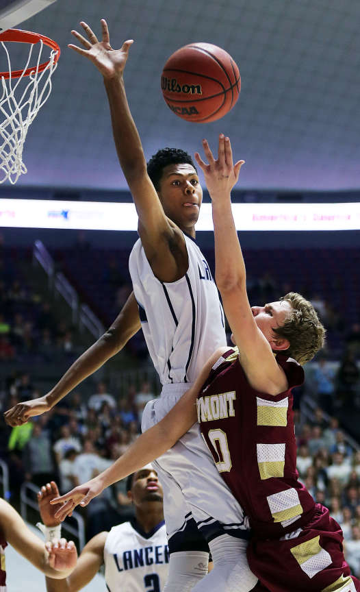Jakoby Kemp of Layton goes for a block against Jake Walker of Viewmont during the Class 5A boys basketball state tournament in Ogden, Friday, Feb. 27, 2015. (Ravell Call/Deseret News)