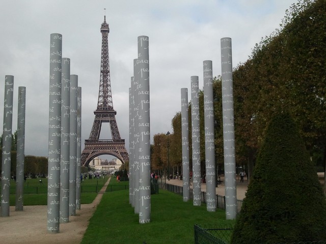 The Eiffel Tower peeks through The Wall for Peace monument in Paris. (A. Pawlowski/CNN)