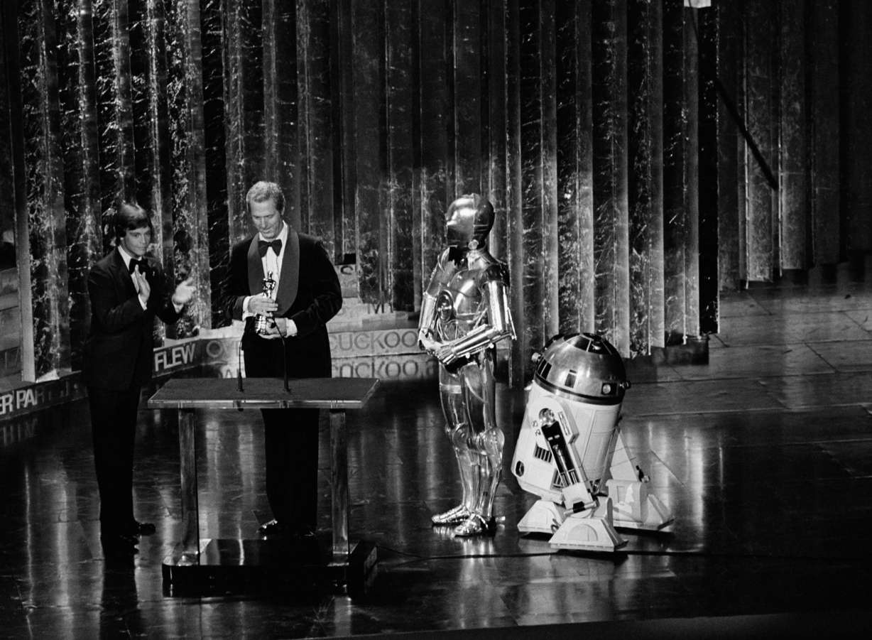 "Star Wars" robots R2D2 and C3P0 at the Academy Awards with Mark Hamill who also starred in the movie as Luke Skywalker shown April 3, 1978. (AP Photo)