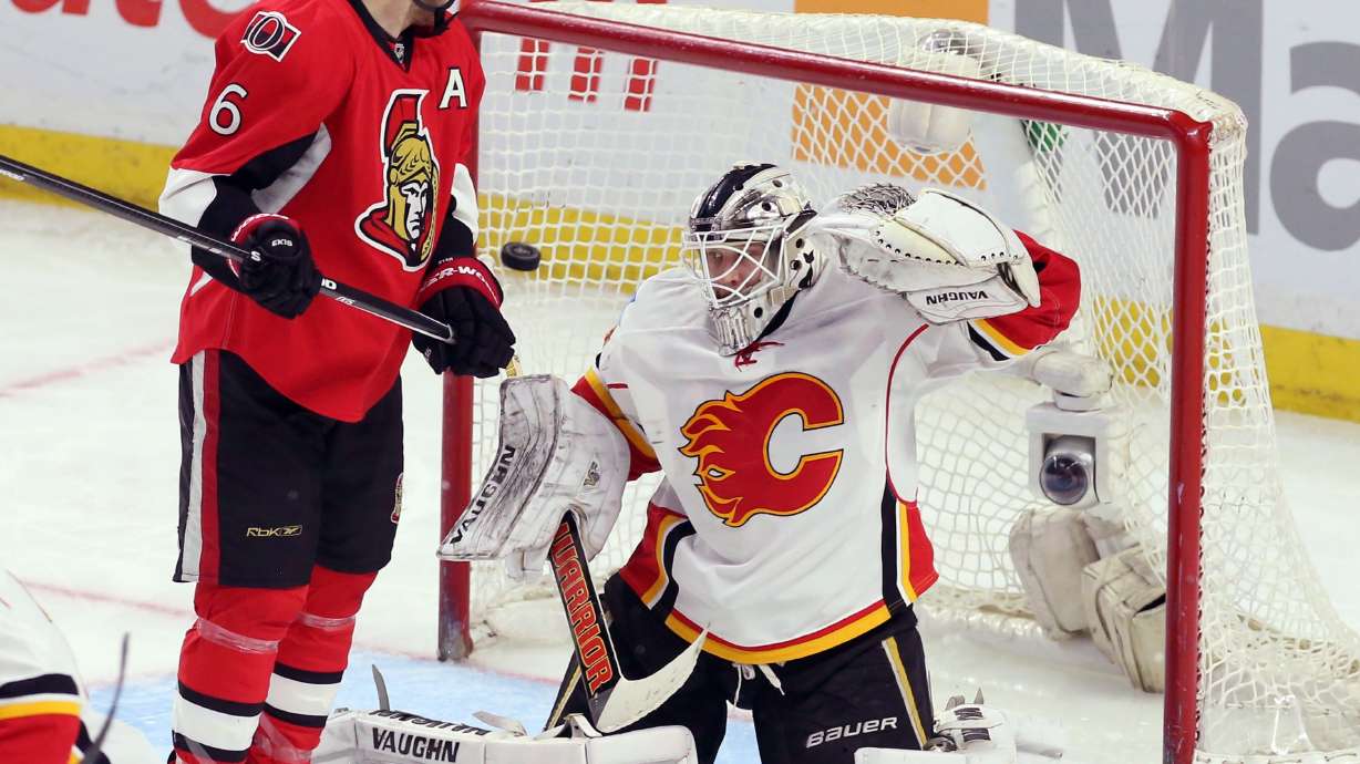 Senators blow big lead, beat Flames 5-4 in shootout