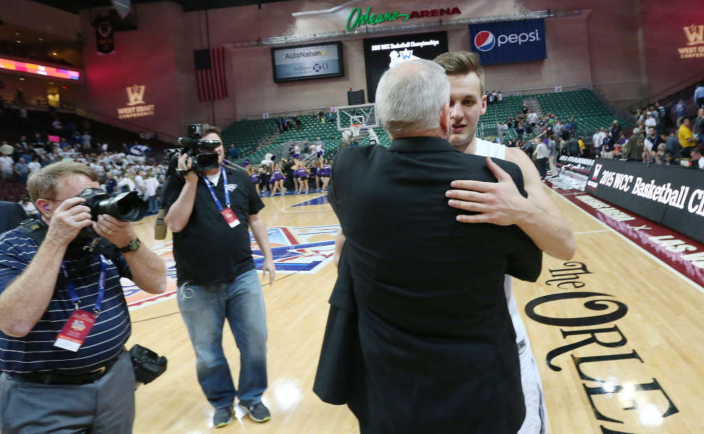 BYU guard Kyle Collinsworth (5) hugs head coach Dave Rose after the West Coast Conference Basketball Championships semifinal game in Las Vegas on Mar 9, 2015. BYU won 84-70. (Photo: Jeffrey D. Allred)