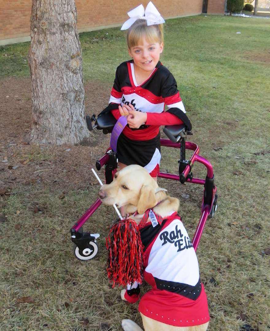 Brianna is a cheerleader and Emily is the squad's mascot. (Photo: Family photo)