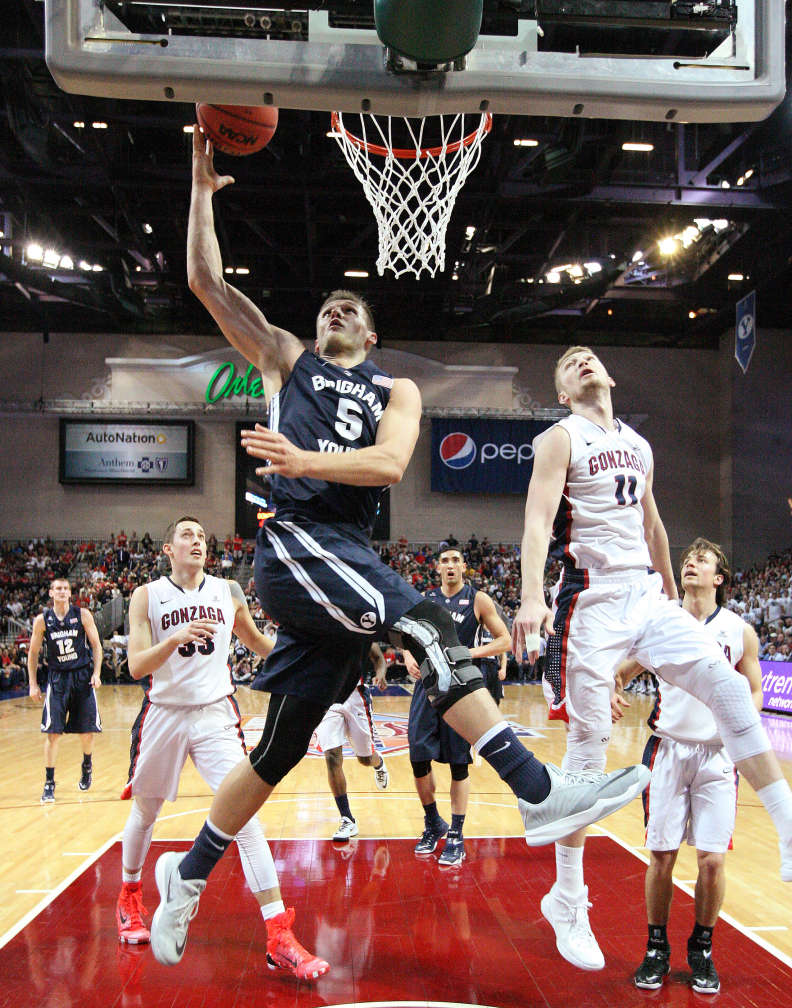 BYU's Kyle Collinsworth (5) shoots by Gonzaga forward Domantas Sabonis (11) during the West Coast Conference Basketball Championship game in Las Vegas on March 10, 2015. (Jeffrey D. Allred/Deseret News)