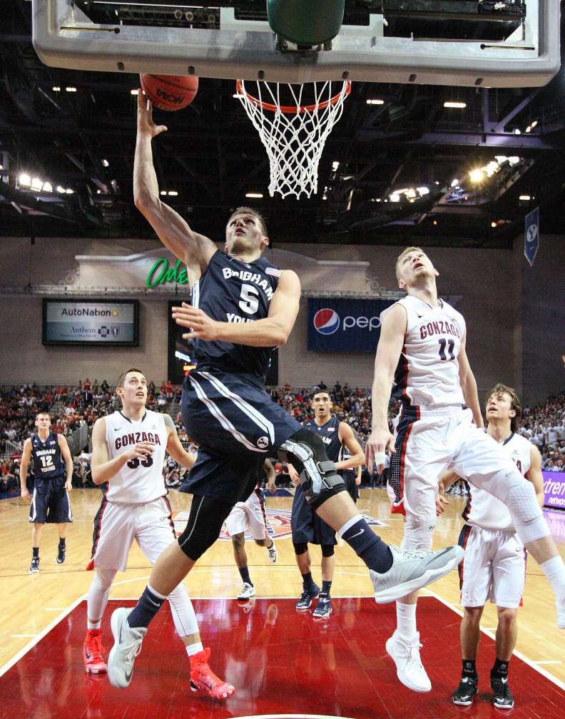 BYU's Kyle Collinsworth (5) shoots by Gonzaga forward Domantas Sabonis (11) during the West Coast Conference Basketball Championship game in Las Vegas on March 10, 2015. (Jeffrey D. Allred/Deseret News)