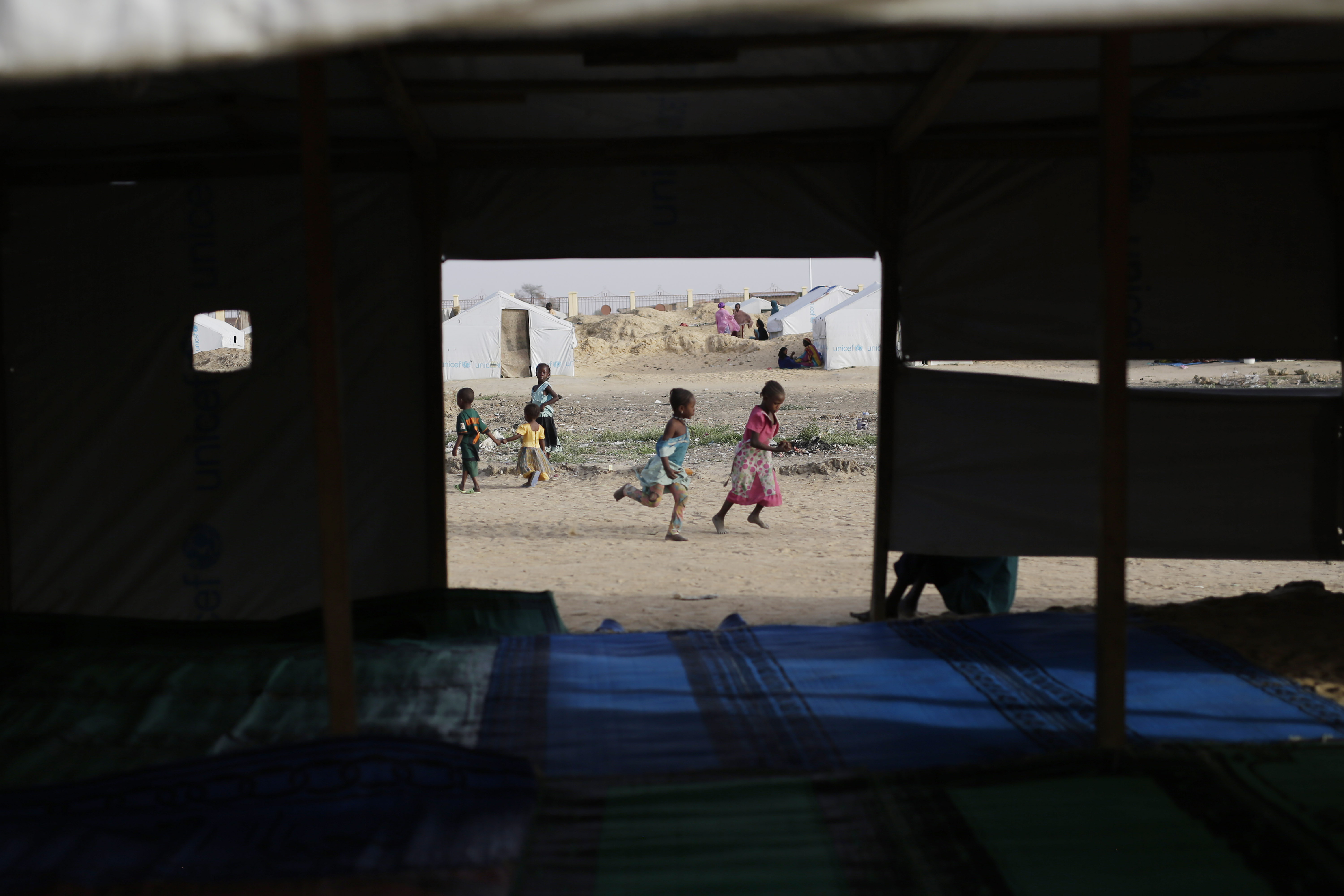 Some kids in refugee camp in Chad learn Quran at whip's lash