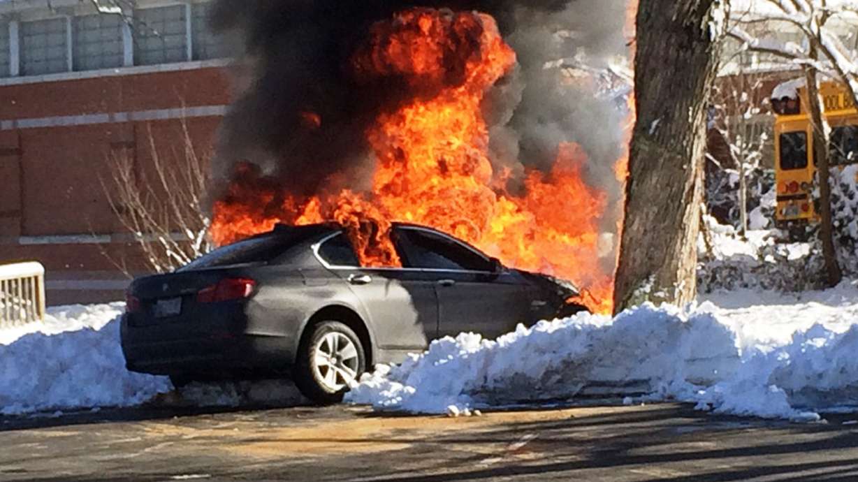 Officer pulls man from burning car, charges him with DWI