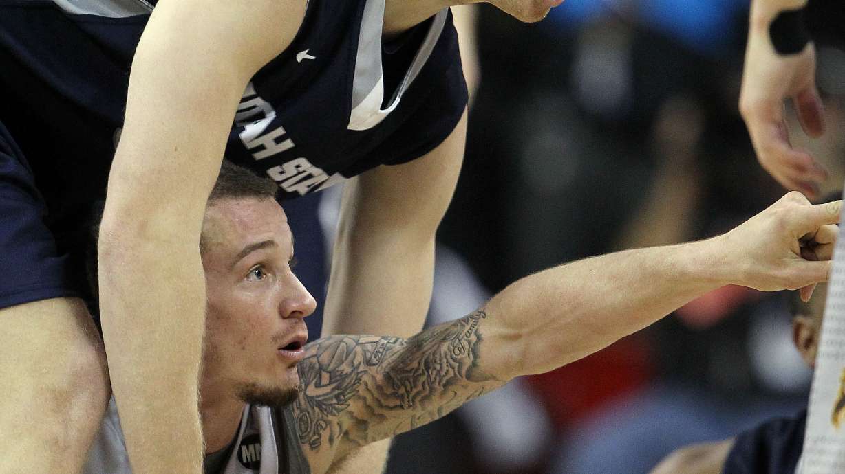 Wyoming knocks off Utah State 67-65 at Mountain West tourney