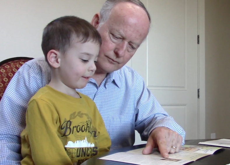 Larry Weber explains colon cancer to his grandson. (Photo: Jen Jacobson)