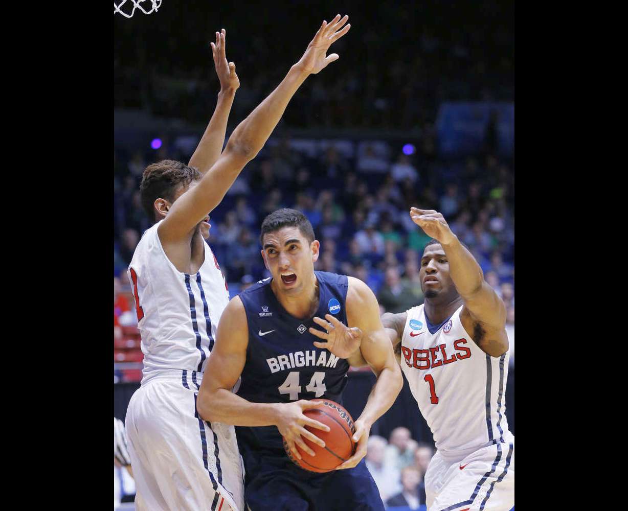 BYU center Corbin Kaufusi (44) is defended by Ole Miss guard Martavious Newby (1) during the NCAA Tournament in Dayton, Ohio Monday, March 17, 2015. BYU lost 94-90. (Jeffrey D. Allred/Deseret News)