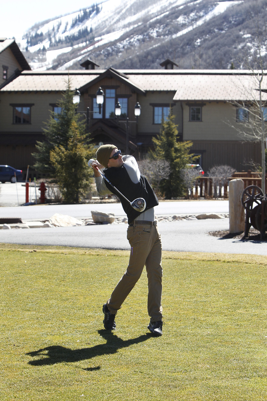 Assistant Golf Pro Ryan Spence takes advantage of the warm weather by playing golf in Park City Thursday, March 19, 2015. (Photo: Chelsey Allder, Deseret News)