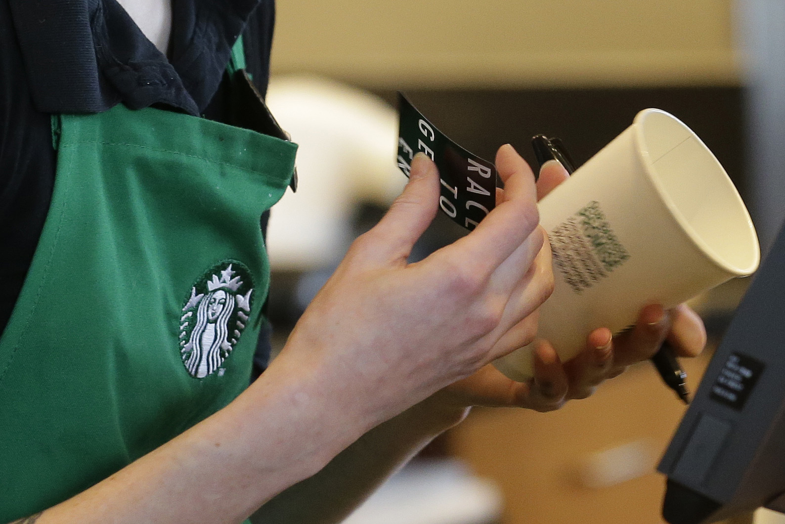 Starbucks baristas stop writing 'Race Together' on cups