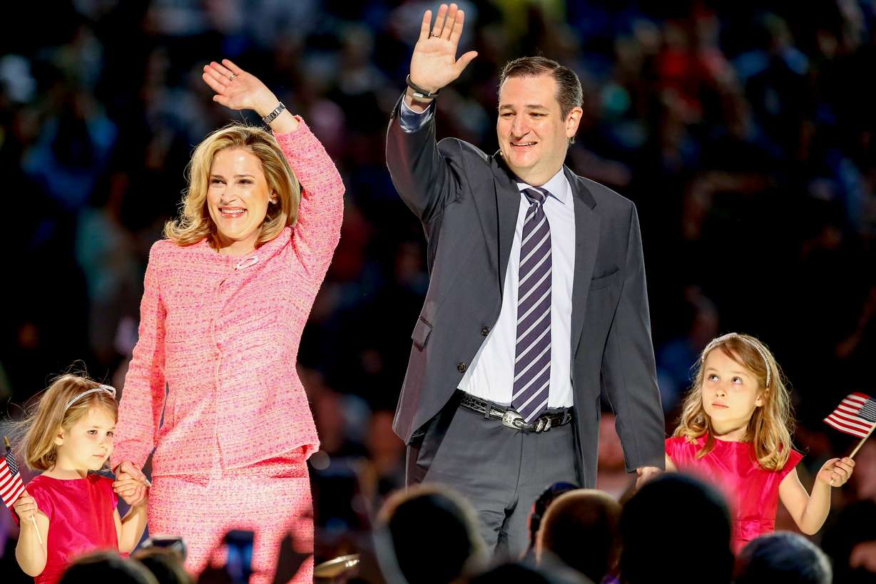 Sen. Ted Cruz, second from right, R-Texas, his wife Heidi, and their two daughters Catherine, left, 4, and Caroline, 6, wave on stage after he announced his campaign for president, Monday, March 23, 2015, at Liberty University, founded by the late Rev. Jerry Falwell, in Lynchburg, Va. Cruz, who announced his candidacy on twitter in the early morning hours, is the first major candidate in the 2016 race for president. (AP Photo/Andrew Harnik)