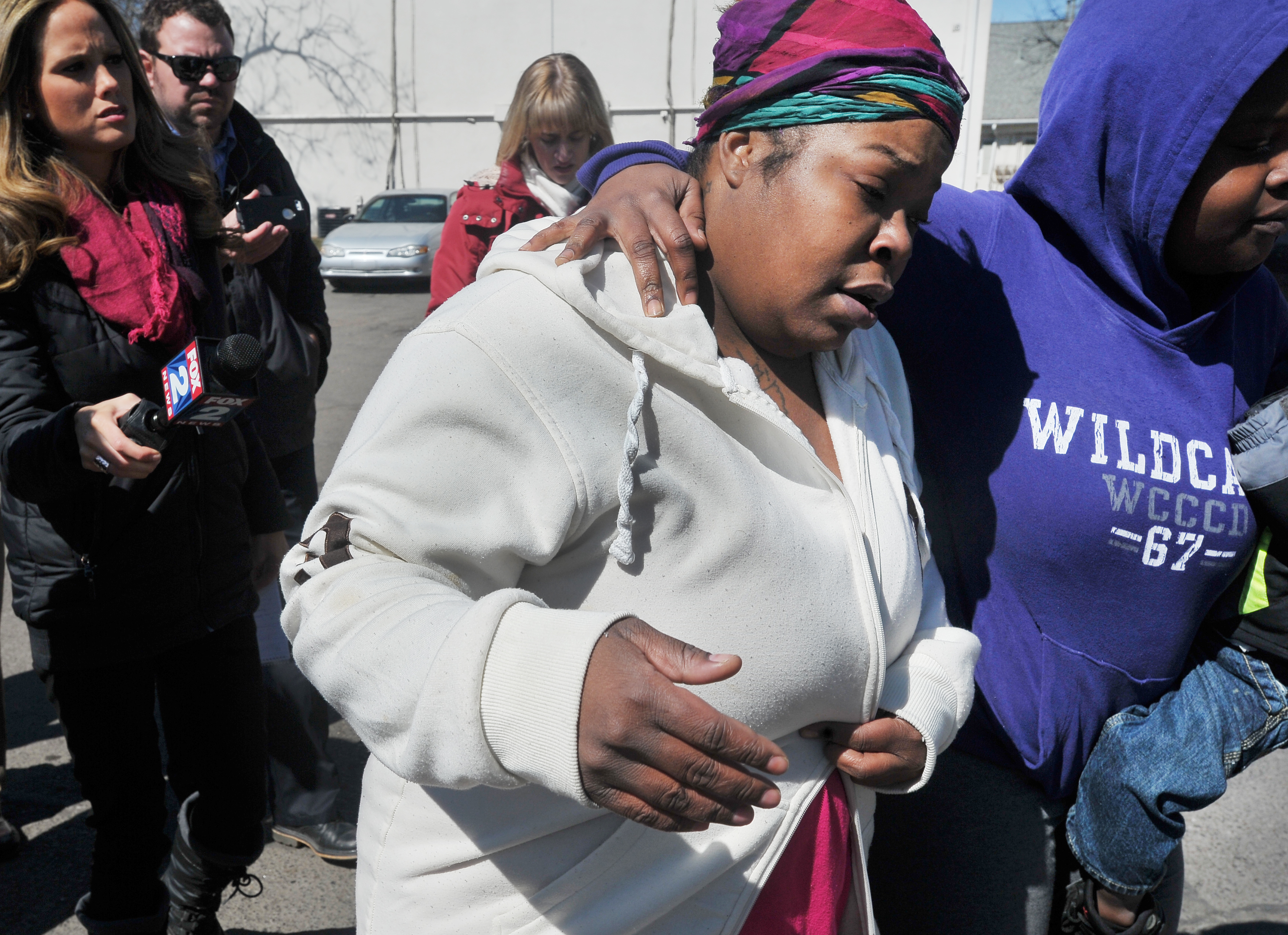 Detroit woman whose 2 kids were found in freezer charged