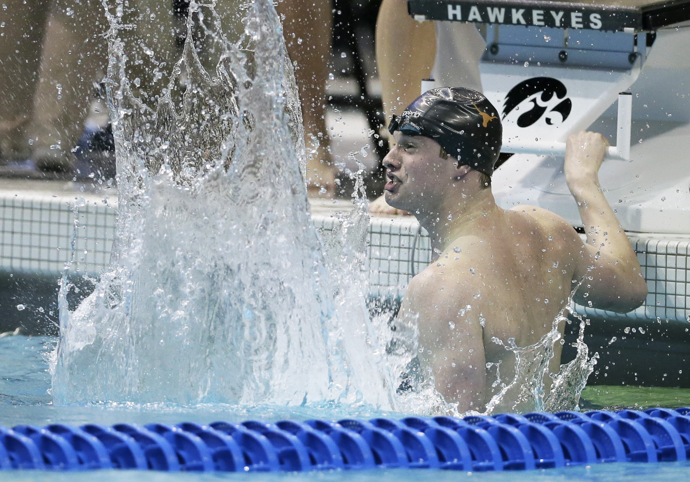 Jack Conger reacts after anchoring his team to victory in the 400-yard medley relay during the NCAA men's swimming and diving championships, Thursday, March 26, 2015, in Iowa City, Iowa. (AP Photo/Charlie Neibergall)