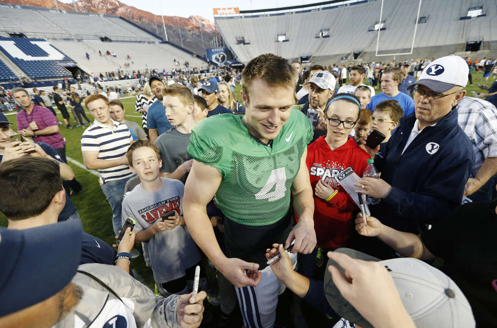 BYU quarterback Taysom Hill talks with fans after the Spring football game in Provo Friday, March 27, 2015. (Photo: Jeffrey D. Allred/Deseret News)