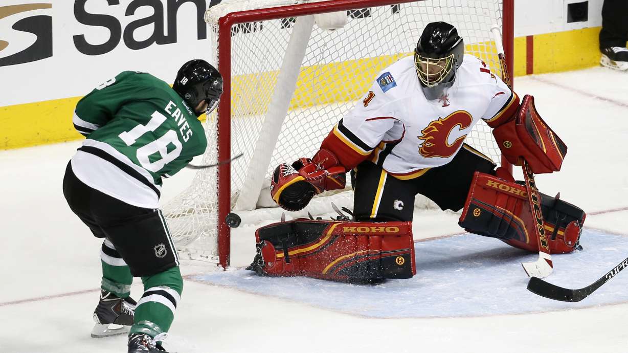 Flames use big 2nd period to beat host Stars 5-3