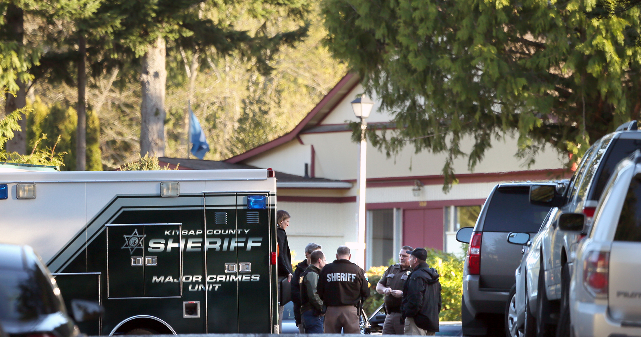 Officers talk to man wounded in mobile home park killings