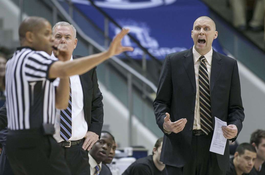 BYU assistant coach Mark Pope tells a referee that they had called a timeout as the Cougars play San Francisco, Feb. 9, 2013. (Photo: Scott G Winterton, Deseret News)